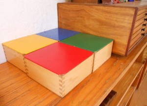 Montessori material designed to teach length and width, probably colours as well
