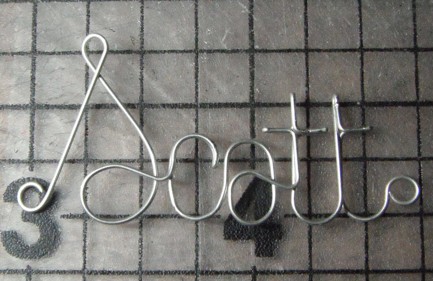 Scott's silver plated wire name